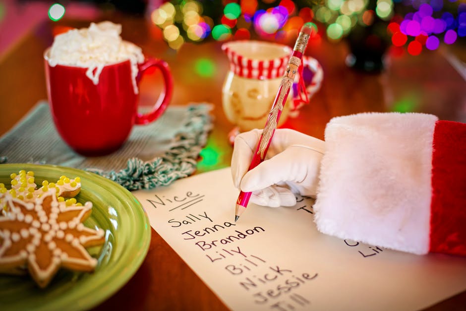 Santa writing up his nice kids list