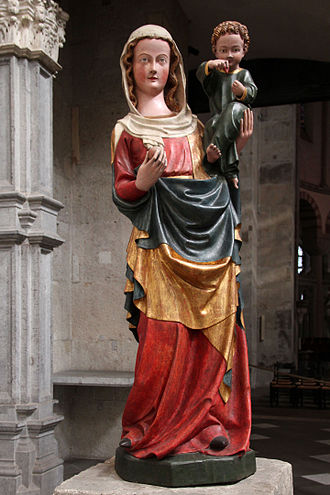 Statue of the Madonna holding the apple along with baby Jesus in St Marys of the Capitol in Cologne, Germany where the apparition occurred with St Herman Joseph