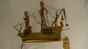 A model of the ship Santa Maria that hangs in the Basilica of Our Lady of Guadalupe in Spain.
