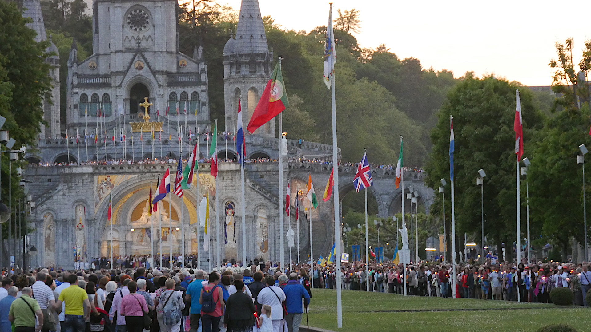 Photo of a long, long line of people. The candlelight processions start at dusk and are a very personal time, though you are with so many other seekers.
