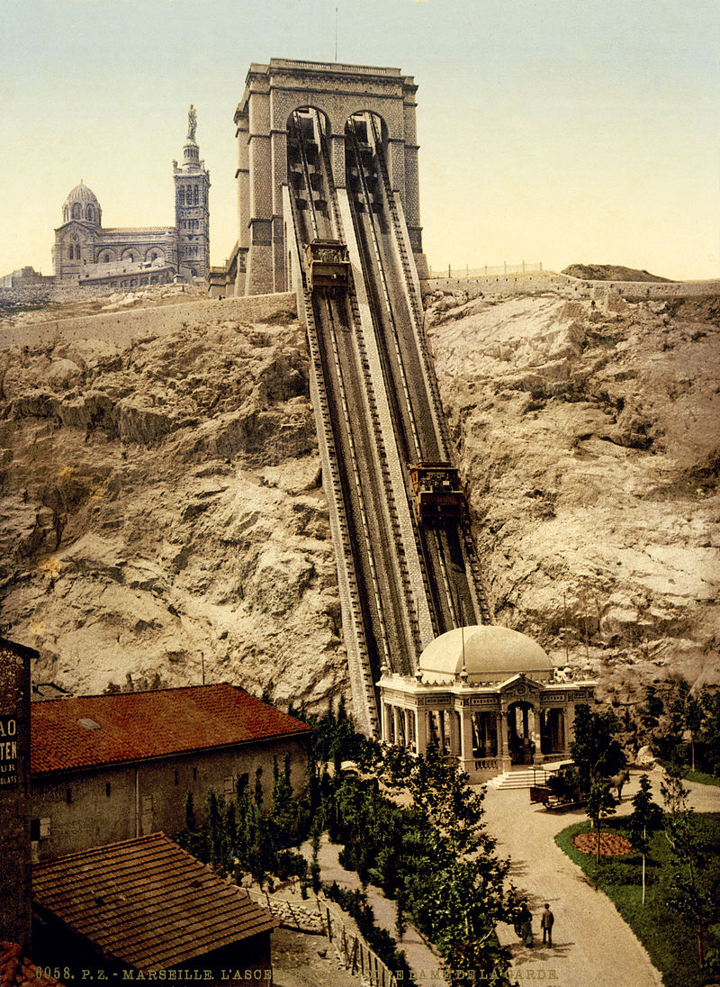 Old time photograph of the lift that allows visitors to easily ascend to the top of the mountain where the Basilica stands with the 30' Madonna placed at it's very top.