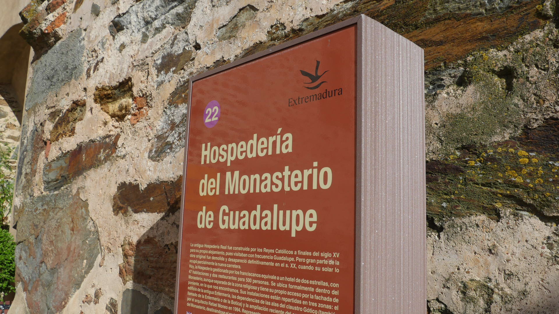 Photo of a sign that tells about the Monastery at Our Lady of Guadalupe, in Extremadura Spain.