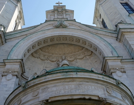 Exterior of the main entrance of OLV, words Hail Our Blessed Lady of Victory above doors