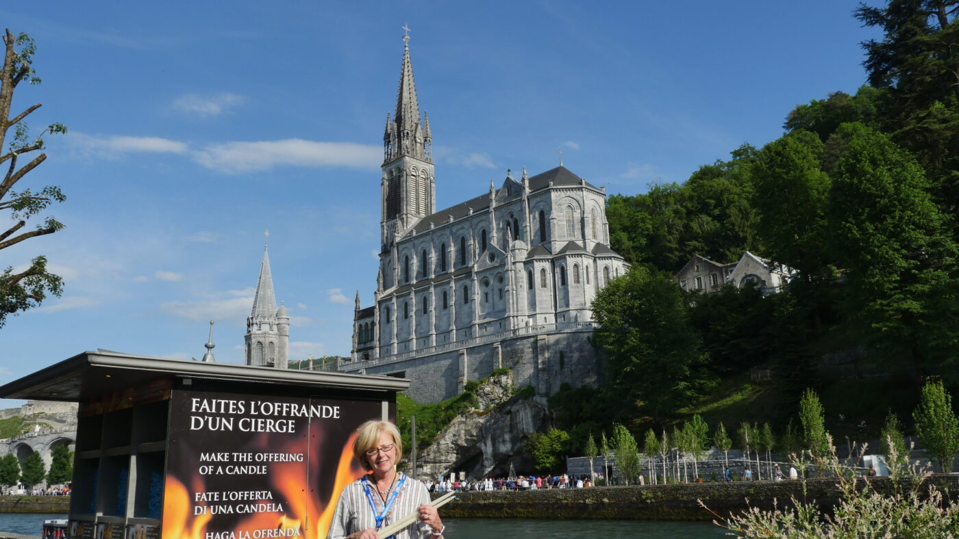 A vista showing one stand of candles at the "Chapel of Light" location that is across the river from the Basilica at the Lourdes, France apparition site.