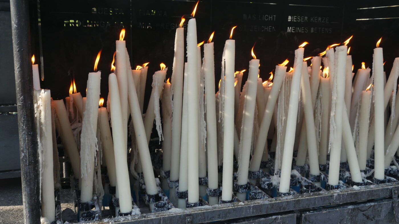 A few candles at the "Chapel of Light" at the Lourdes, France apparition site.