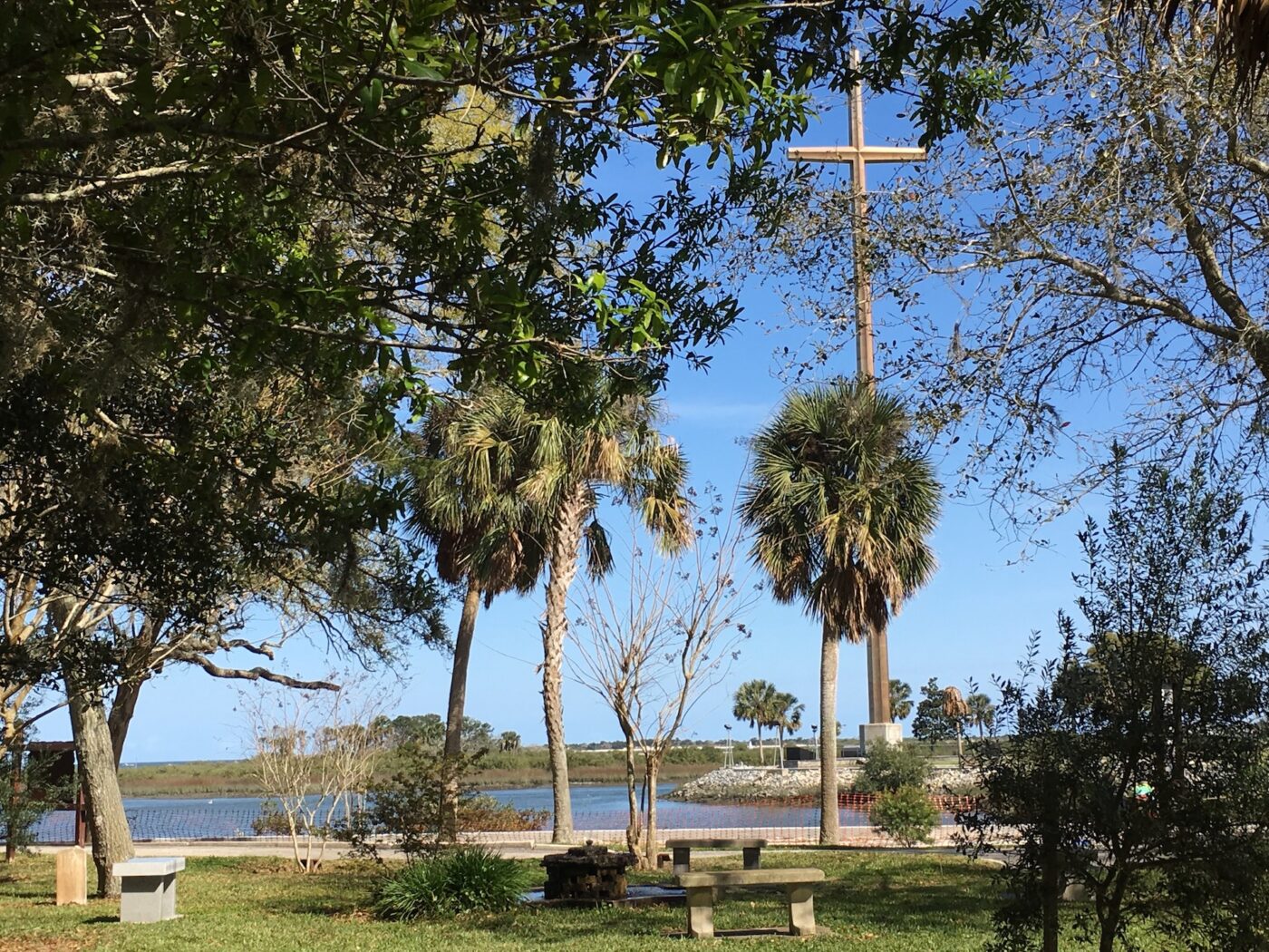 Pictured is a the 200' tall cross on the grounds of the Our Lady of La Leche Shrine in St. Augustine, Fllorida. Also in view is the ocean and palm trees.