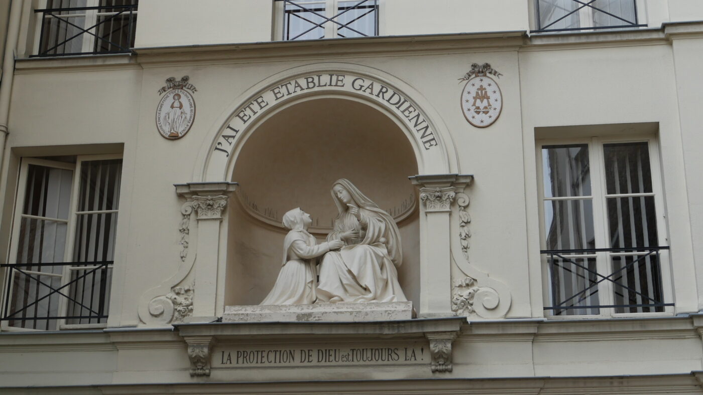 Chapel of Our Lady of the Miraculous Metal on Rue de Bac, in Paris. This is a close up of a sculpture of The Virgin Mary talking to Catherine Labouré who is kneeling next to her.